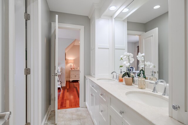 48 Mount Nebo Rd, Newtown, CT 06470 - full bathroom with double vanity, connected bathroom, and baseboards
