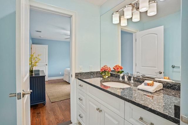 211 Linden Tree Rd, Wilton, CT 06897 - bathroom with wood finished floors, vanity, and baseboards
