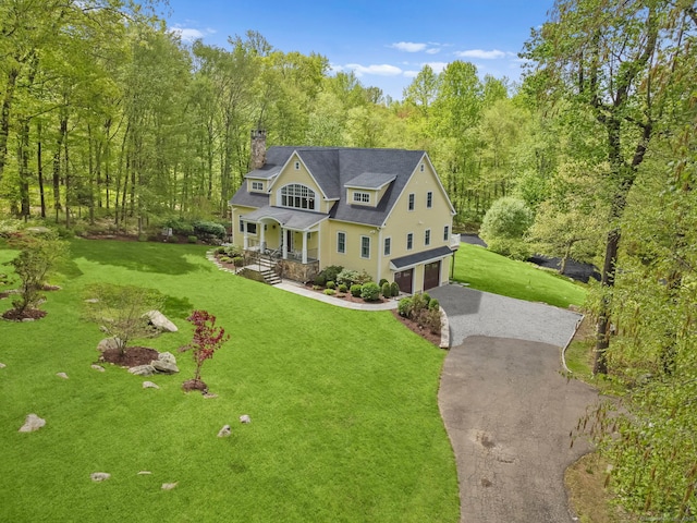 211 Linden Tree Rd, Wilton, CT 06897 - shingle-style home with driveway, a garage, covered porch, a chimney, and a front yard