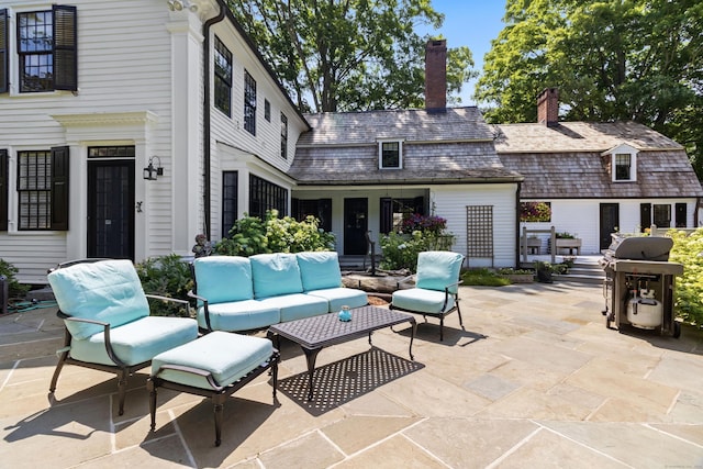 view of patio / terrace featuring an outdoor hangout area and a grill