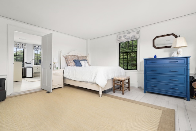 bedroom featuring light wood-style floors