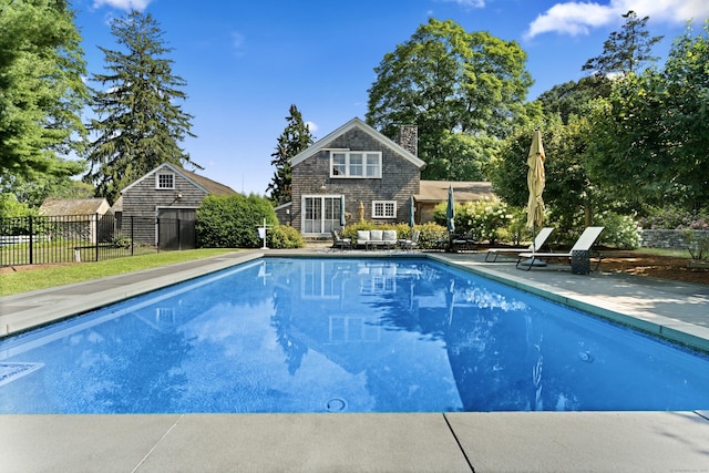 view of pool featuring fence, a patio area, and a fenced in pool