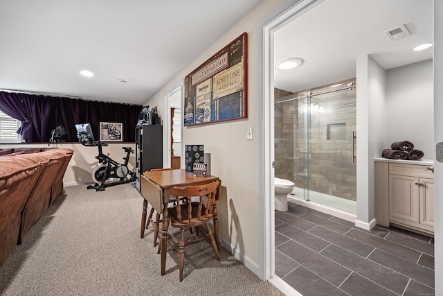 bedroom with baseboards, connected bathroom, multiple windows, and recessed lighting