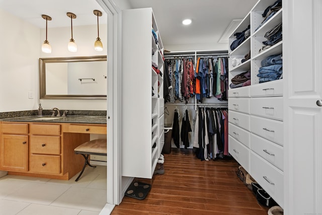spacious closet featuring wood finished floors