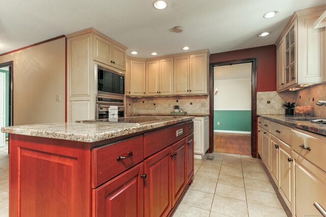 14 Valley View Dr, Wallingford, CT 06492 - kitchen featuring recessed lighting, decorative backsplash, light tile patterned flooring, and black appliances