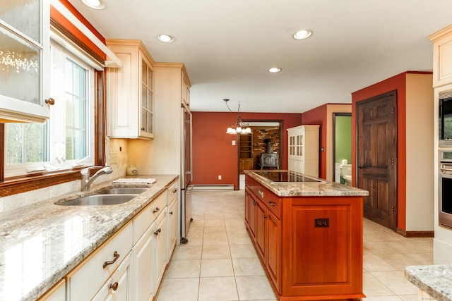 14 Valley View Dr, Wallingford, CT 06492 - kitchen featuring a wood stove, a sink, glass insert cabinets, stainless steel appliances, and recessed lighting