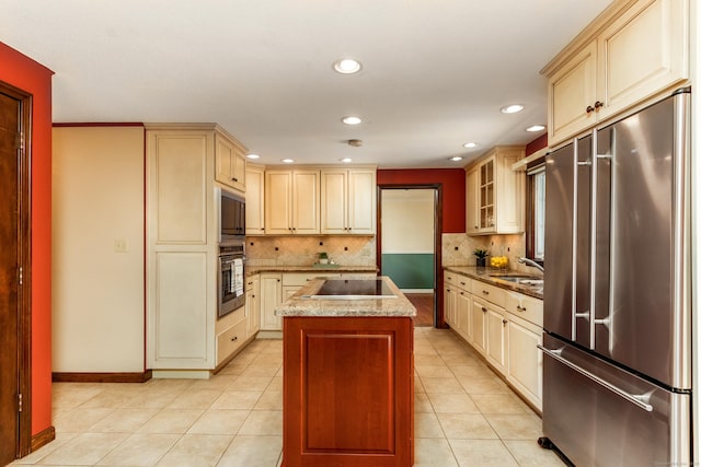 14 Valley View Dr, Wallingford, CT 06492 - kitchen featuring a center island, recessed lighting, cream cabinetry, tasteful backsplash, and black appliances