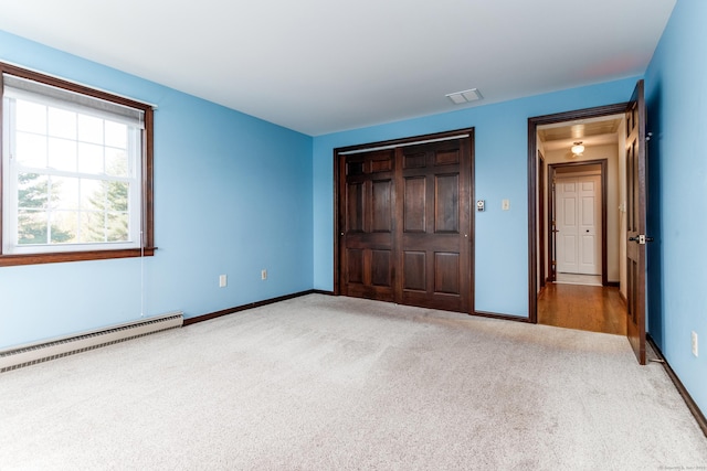 14 Valley View Dr, Wallingford, CT 06492 - unfurnished bedroom featuring carpet floors, baseboards, baseboard heating, and a closet