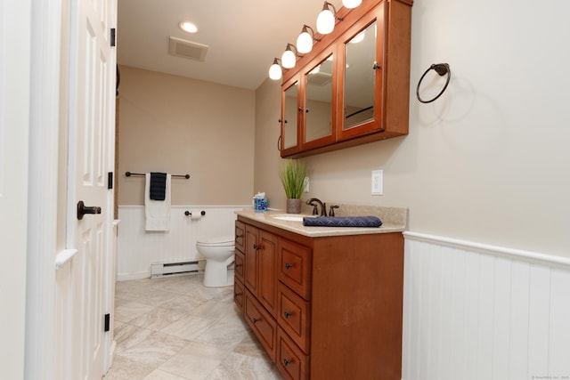 14 Valley View Dr, Wallingford, CT 06492 - bathroom featuring vanity, visible vents, wainscoting, toilet, and baseboard heating