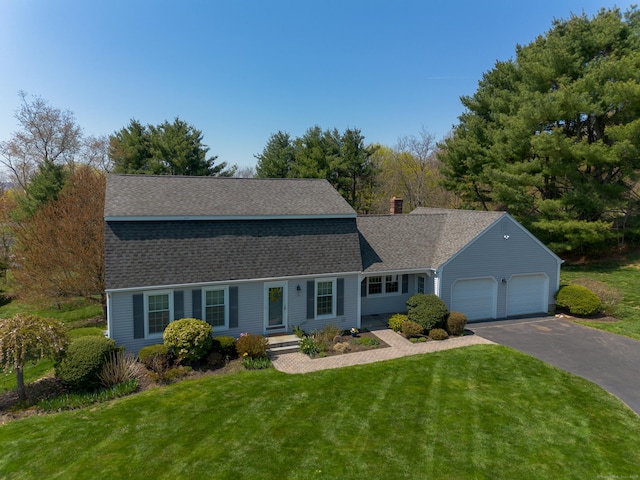 14 Valley View Dr, Wallingford, CT 06492 - colonial inspired home with a front lawn, aphalt driveway, roof with shingles, a chimney, and an attached garage