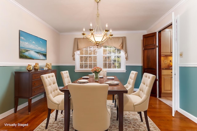 14 Valley View Dr, Wallingford, CT 06492 - dining area featuring baseboards, an inviting chandelier, ornamental molding, and wood finished floors