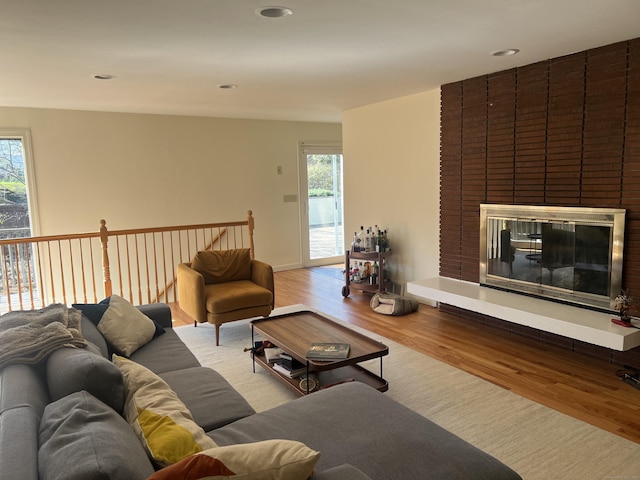 12 Fox Rd, Trumbull, CT 06611 - living area with wood finished floors, a brick fireplace, and recessed lighting