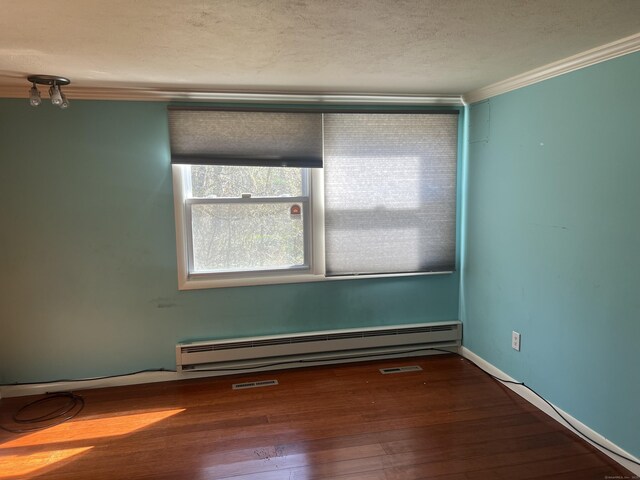 12 Fox Rd, Trumbull, CT 06611 - unfurnished room featuring a baseboard heating unit, ornamental molding, wood finished floors, and a textured ceiling
