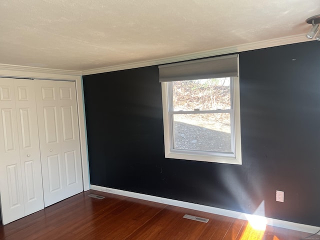 12 Fox Rd, Trumbull, CT 06611 - unfurnished bedroom featuring wood finished floors, a closet, and crown molding