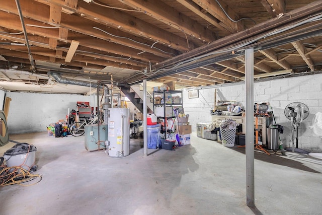 unfinished basement featuring gas water heater and stairs
