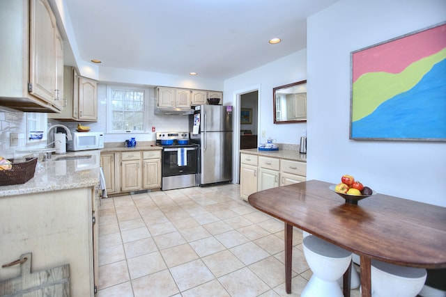1 Graystone Ln, Weston, CT 06880 - kitchen featuring appliances with stainless steel finishes, under cabinet range hood, backsplash, light tile patterned floors, and recessed lighting