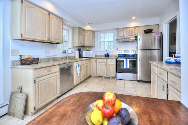 1 Graystone Ln, Weston, CT 06880 - kitchen with stainless steel appliances, healthy amount of natural light, tasteful backsplash, under cabinet range hood, and recessed lighting