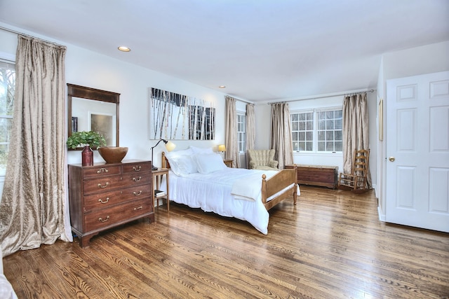 bedroom with recessed lighting and wood finished floors