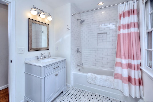 full bath featuring recessed lighting, shower / bath combination with curtain, vanity, and baseboards