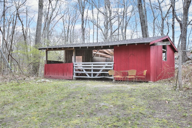 view of outbuilding featuring an outdoor structure and an exterior structure