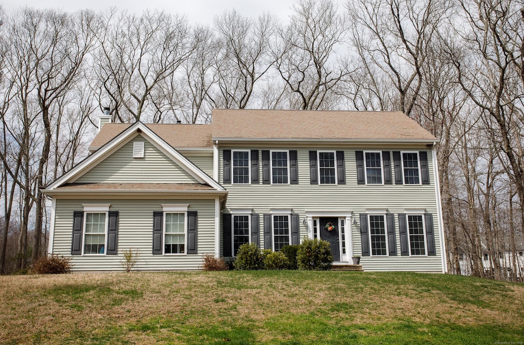 112 Bartman Rd, Haddam, CT 06441 - colonial-style house with a front lawn and a chimney