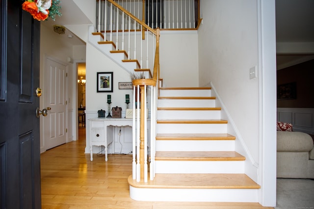 stairway featuring wood finished floors
