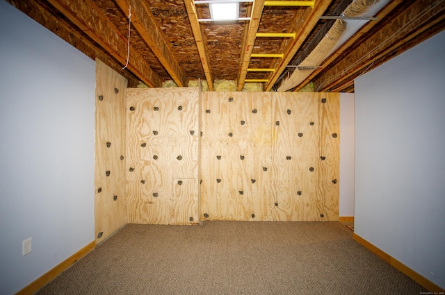 below grade area featuring carpet flooring