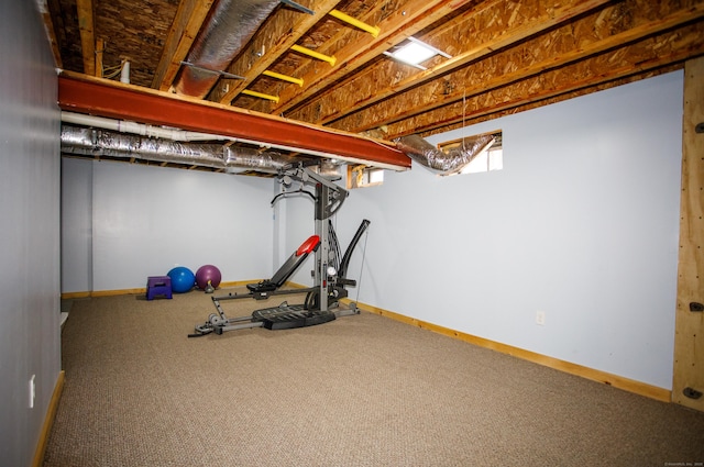 workout area with baseboards and carpet floors