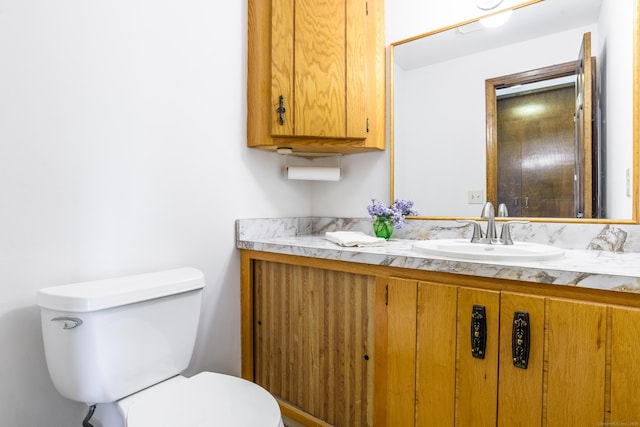 half bath with toilet and vanity