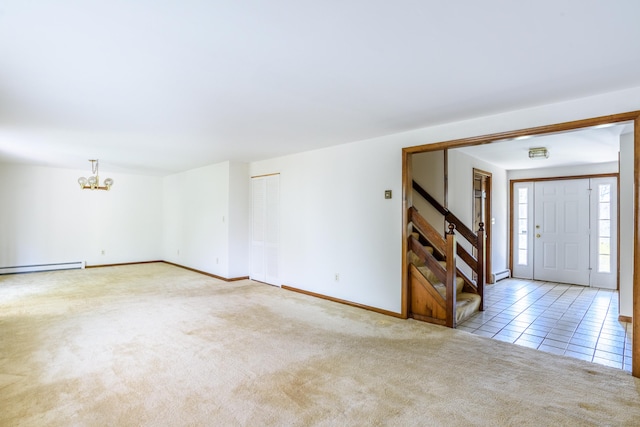 interior space featuring stairway, a baseboard heating unit, baseboards, carpet floors, and a notable chandelier