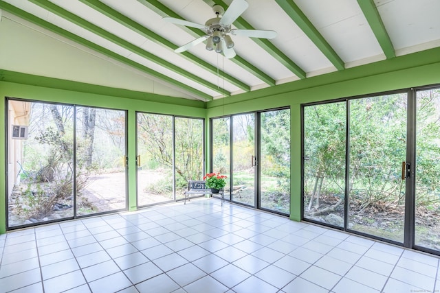 unfurnished sunroom with tile patterned floors, lofted ceiling with beams, and ceiling fan