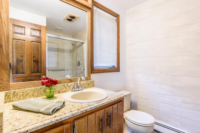 full bath with a baseboard heating unit, a shower stall, vanity, toilet, and visible vents