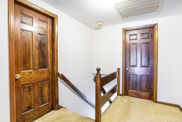 interior space with carpet and baseboards