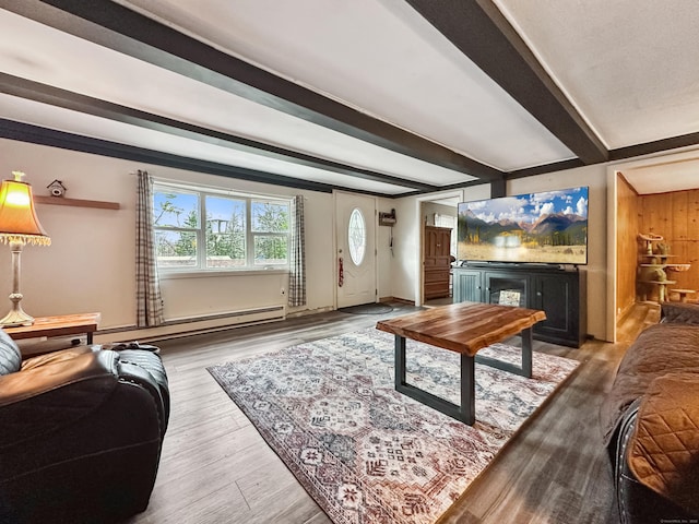 living area featuring wood finished floors, a fireplace, a baseboard heating unit, and beam ceiling