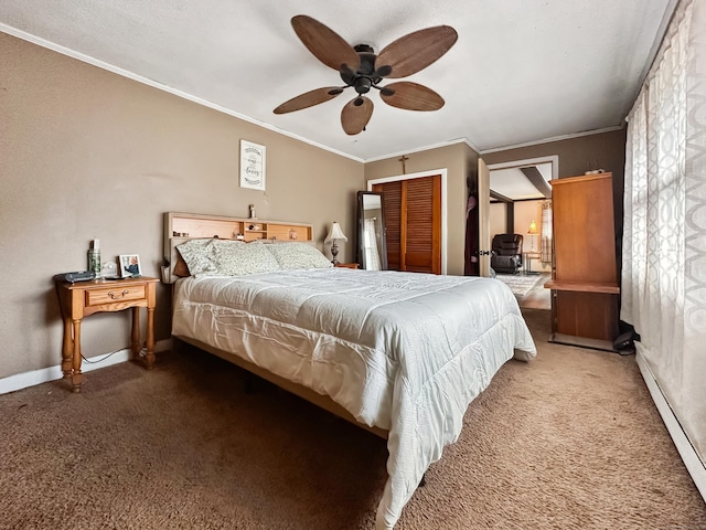 bedroom with baseboards, carpet flooring, a ceiling fan, and ornamental molding