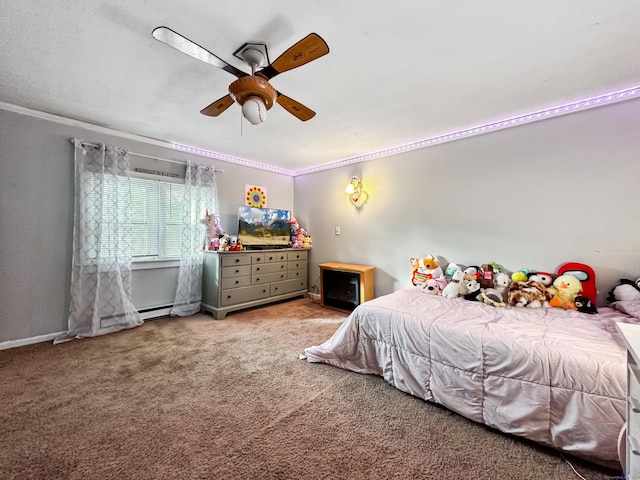 carpeted bedroom with crown molding, baseboards, and ceiling fan