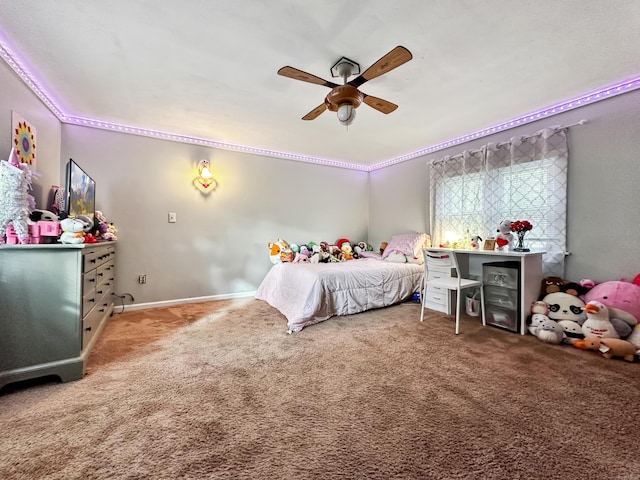 bedroom with crown molding, baseboards, ceiling fan, and carpet flooring