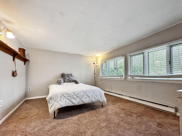 bedroom with carpet floors, baseboards, and a baseboard radiator