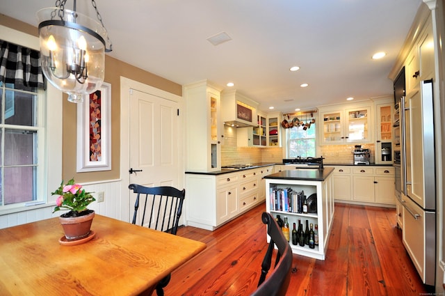 794 Main St, Somers, CT 06071 - kitchen featuring dark countertops, a chandelier, a center island, tasteful backsplash, and open shelves