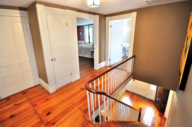 794 Main St, Somers, CT 06071 - staircase featuring wood-type flooring and baseboards