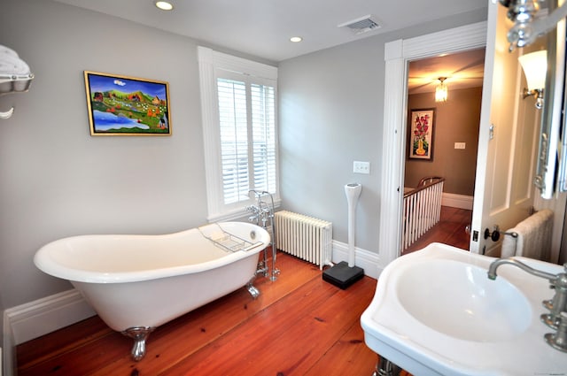 794 Main St, Somers, CT 06071 - full bathroom with radiator heating unit, a sink, a freestanding bath, healthy amount of natural light, and recessed lighting