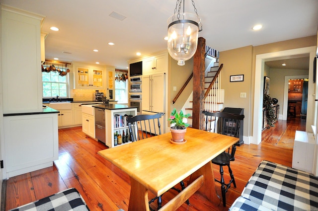 794 Main St, Somers, CT 06071 - dining space with recessed lighting, light wood-type flooring, stairway, and a chandelier