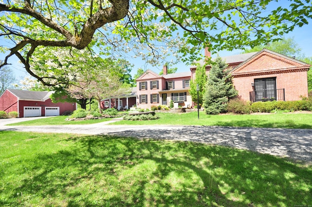 794 Main St, Somers, CT 06071 - view of front of property featuring a front yard, driveway, and brick siding