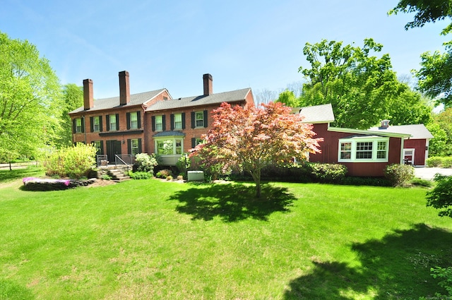 794 Main St, Somers, CT 06071 - back of house featuring a yard and a chimney