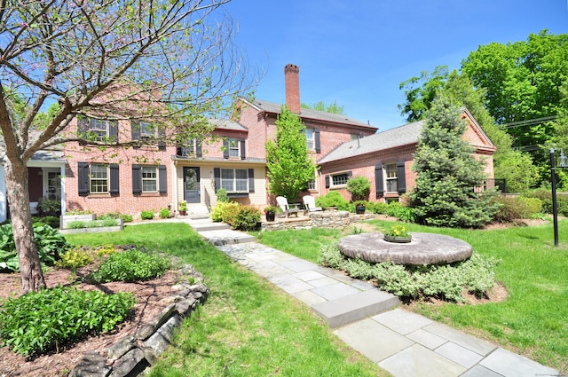 794 Main St, Somers, CT 06071 - view of front of property featuring a front lawn, brick siding, and a fire pit