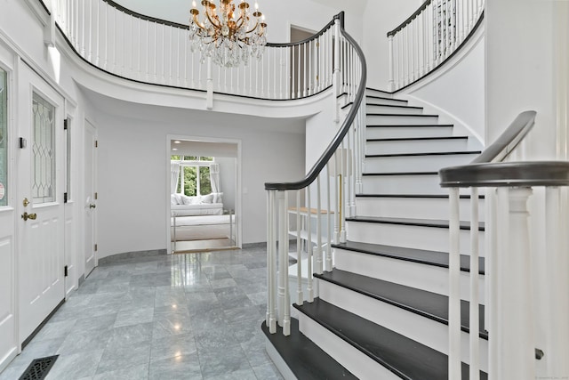5 Tall Oaks Rd, Wilton, CT 06897 - foyer entrance with a towering ceiling, a chandelier, stairs, and marble tiled flooring