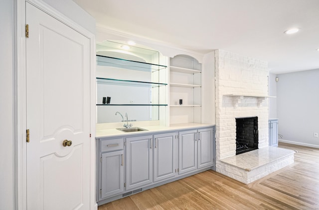 5 Tall Oaks Rd, Wilton, CT 06897 - indoor wet bar featuring light wood-style floors, a large fireplace, and recessed lighting