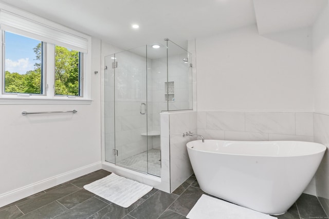 5 Tall Oaks Rd, Wilton, CT 06897 - full bathroom with a stall shower, a freestanding tub, tile walls, recessed lighting, and a wainscoted wall