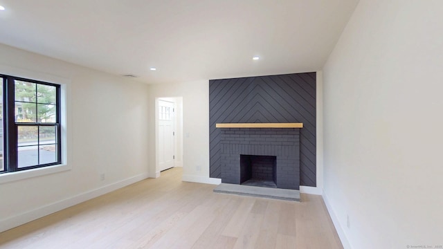 101 Parade Hill Rd, New Canaan, CT 06840 - unfurnished living room featuring visible vents, baseboards, light wood-type flooring, a fireplace, and recessed lighting