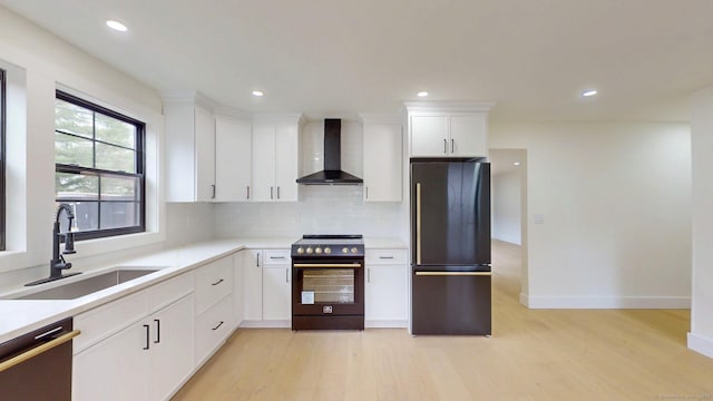 101 Parade Hill Rd, New Canaan, CT 06840 - kitchen with wall chimney exhaust hood, range with electric cooktop, dishwasher, a sink, and freestanding refrigerator